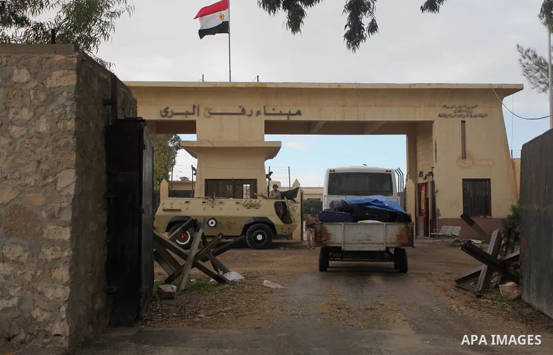 An Egyptian security force stands guard at the Rafah border crossing between Egypt and the southern Gaza Strip December 21, 2014. Egypt opened the Rafah border crossing on Sunday allowing Palestinians from Gaza Strip to...