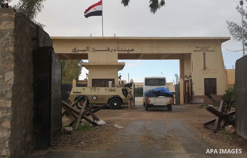 An Egyptian security force stands guard at the Rafah border crossing between Egypt and the southern Gaza Strip December 21, 2014. Egypt opened the Rafah border crossing on Sunday allowing Palestinians from Gaza Strip to...