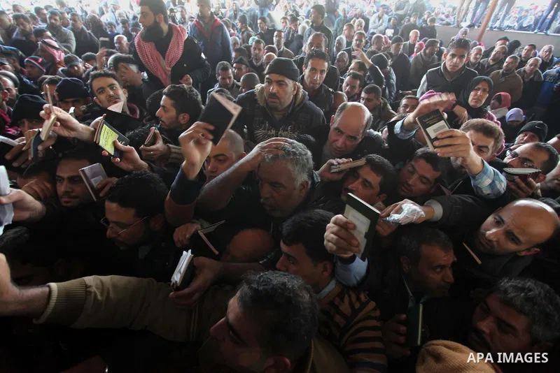 Palestinians hoping to cross into Egypt, wait with their relatives at the Rafah crossing between Egypt and the southern Gaza Strip December 21, 2014. Egypt opened the Rafah border crossing on Sunday allowing Palestinians...