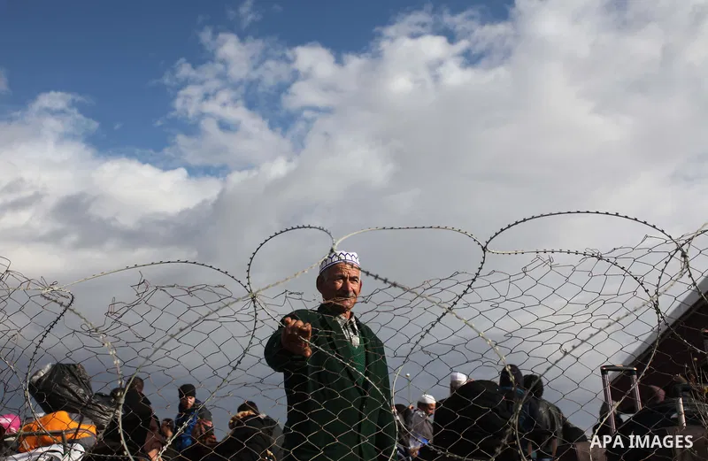 Palestinians hoping to cross into Egypt, wait with their relatives at the Rafah crossing between Egypt and the southern Gaza Strip December 21, 2014. Egypt opened the Rafah border crossing on Sunday allowing Palestinians...