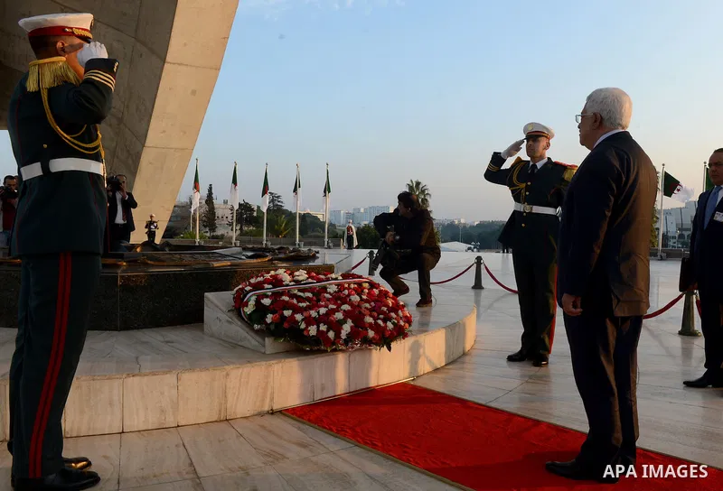 Palestinian President Mahmoud Abbas lays a wreath at the tomb of the Unknown Soldier, in Algeria on December 21, 2014. Abbas is on a three-day official visit and he is expected to meet several officials. Photo by Thaer G...