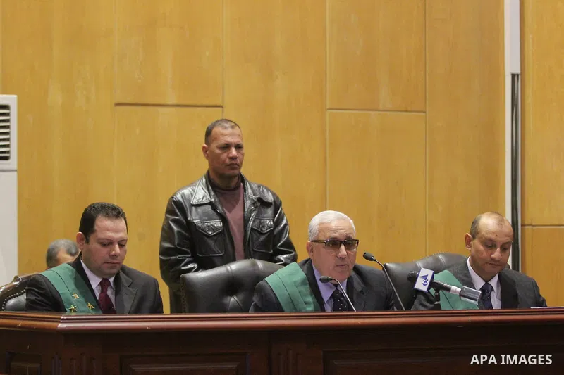 The Judge of the 'Port Said Massacre' case, speaks with witnesses during the trial of suspects in Cairo on December 23, 2014. The defendants were originally given sentences ranging from 15 years to life in prison. They w...