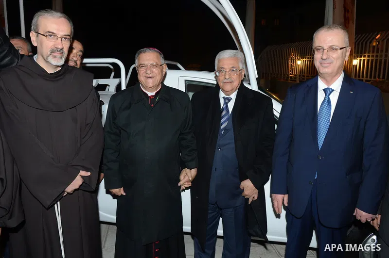 Palestinian President Mahmoud Abba visits the Pope John Paul II Foundation in the West Bank city of Bethlehem December 24, 2014. Photo by Thaer Ganaim