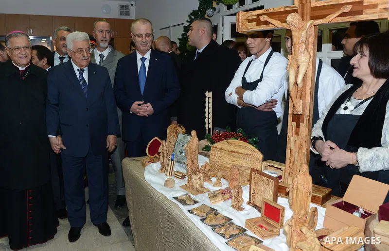 Palestinian President Mahmoud Abba visits the Pope John Paul II Foundation in the West Bank city of Bethlehem December 24, 2014. Photo by Thaer Ganaim