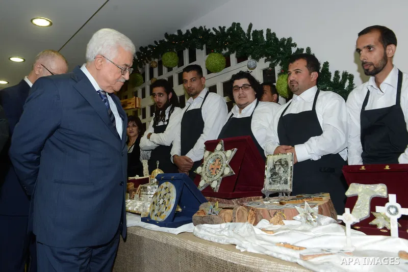Palestinian President Mahmoud Abba visits the Pope John Paul II Foundation in the West Bank city of Bethlehem December 24, 2014. Photo by Thaer Ganaim