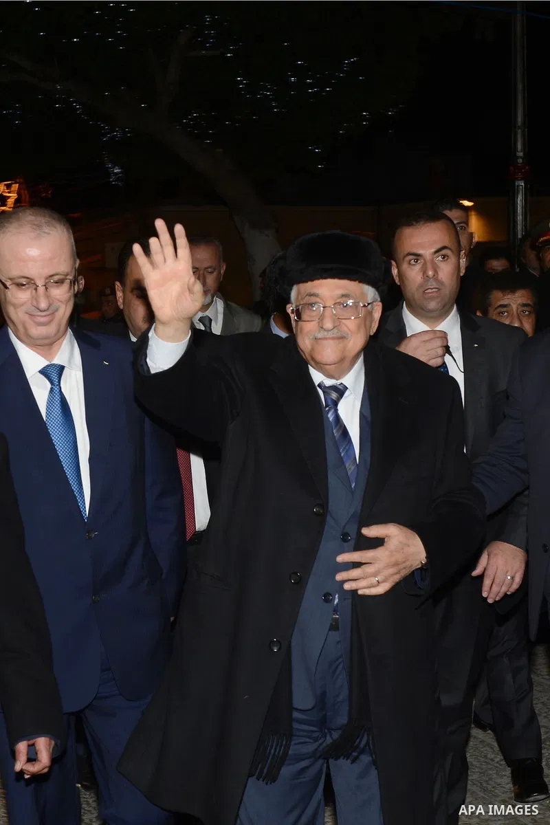 Palestinian President Mahmoud Abba visits a dinner at Franciscan monastery in the West Bank city of Bethlehem December 24, 2014. Photo by Thaer Ganaim