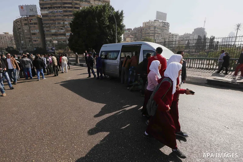 Egyptians gather at the scene of a bomb attack targeting the University bridge, Cairo December 28, 2014. Egypt has seen a wave of bombings and shootings, mainly against army and police personnel, over the past year and a...