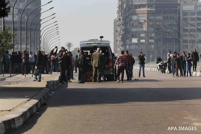 Egyptians gather at the scene of a bomb attack targeting the University bridge, Cairo December 28, 2014. Egypt has seen a wave of bombings and shootings, mainly against army and police personnel, over the past year and a...
