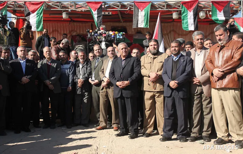 Palestinians take part in a protest calling for end the Israeli illegal blockade on Gaza Strip and against the slow rehabilitation of the strip after damage incurred during the recent Israeli offensive on Gaza Strip, in...