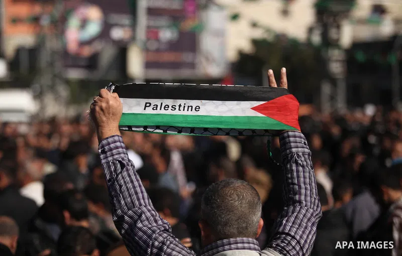 Palestinians take part in a protest calling for end the Israeli illegal blockade on Gaza Strip and against the slow rehabilitation of the strip after damage incurred during the recent Israeli offensive on Gaza Strip, in...