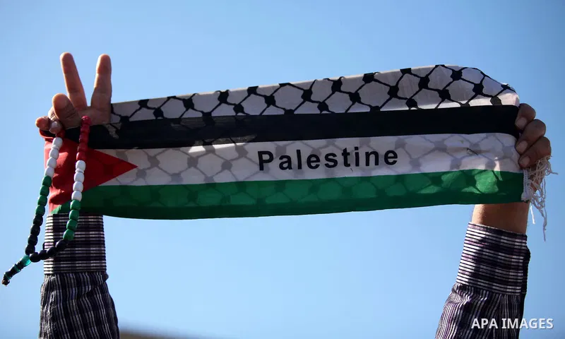 Palestinians take part in a protest calling for end the Israeli illegal blockade on Gaza Strip and against the slow rehabilitation of the strip after damage incurred during the recent Israeli offensive on Gaza Strip, in...