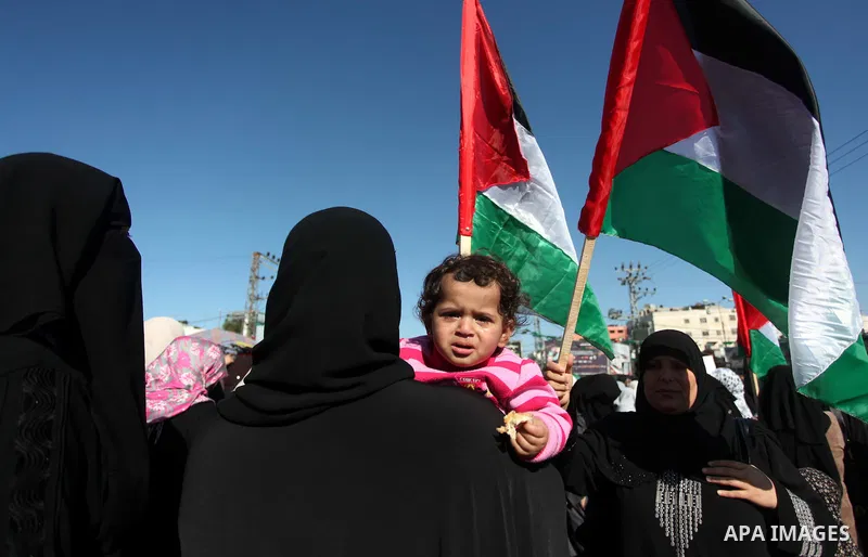 Palestinians take part in a protest calling for end the Israeli illegal blockade on Gaza Strip and against the slow rehabilitation of the strip after damage incurred during the recent Israeli offensive on Gaza Strip, in...