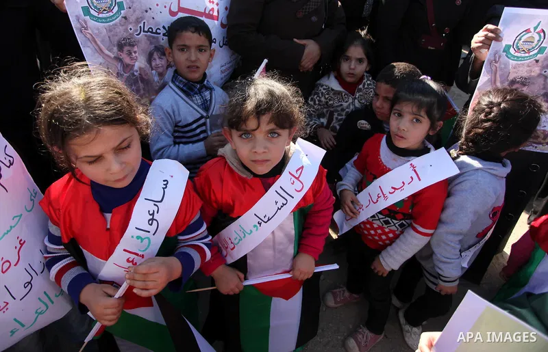 Palestinians take part in a protest calling for end the Israeli illegal blockade on Gaza Strip and against the slow rehabilitation of the strip after damage incurred during the recent Israeli offensive on Gaza Strip, in...