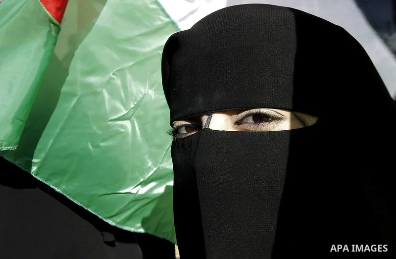 A Palestinian woman takes part in a protest calling for end the Israeli illegal blockade on Gaza Strip and against the slow rehabilitation of the strip after damage incurred during the recent Israeli offensive on Gaza St...