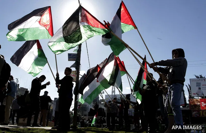 Palestinians take part in a protest calling for end the Israeli illegal blockade on Gaza Strip and against the slow rehabilitation of the strip after damage incurred during the recent Israeli offensive on Gaza Strip, in...