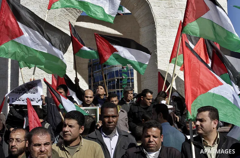 Palestinians take part in a protest calling for end the Israeli illegal blockade on Gaza Strip and against the slow rehabilitation of the strip after damage incurred during the recent Israeli offensive on Gaza Strip, in...