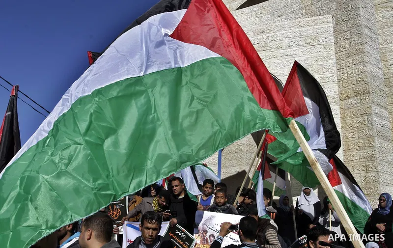Palestinians take part in a protest calling for end the Israeli illegal blockade on Gaza Strip and against the slow rehabilitation of the strip after damage incurred during the recent Israeli offensive on Gaza Strip, in...