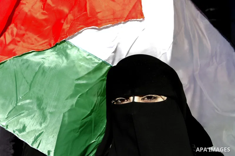 A Palestinian woman takes part in a protest calling for end the Israeli illegal blockade on Gaza Strip and against the slow rehabilitation of the strip after damage incurred during the recent Israeli offensive on Gaza St...