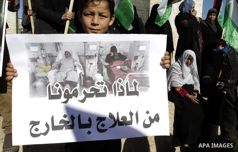 Palestinians take part in a protest calling for end the Israeli illegal blockade on Gaza Strip and against the slow rehabilitation of the strip after damage incurred during the recent Israeli offensive on Gaza Strip, in...