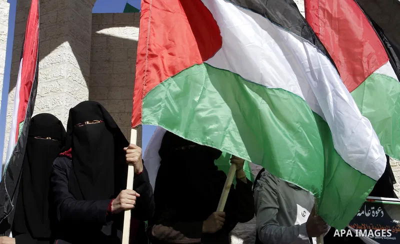 Palestinians take part in a protest calling for end the Israeli illegal blockade on Gaza Strip and against the slow rehabilitation of the strip after damage incurred during the recent Israeli offensive on Gaza Strip, in...