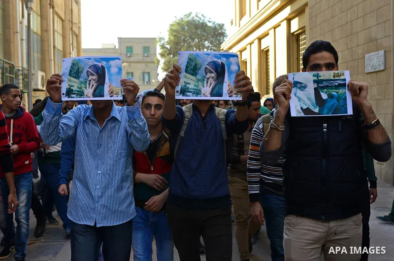 Egyptian supporters of Muslim Brotherhood who belonged to "Students against Coup" movement participate in a demonstration to demand the release of their detained colleagues, outside the Cairo University, Cairo December 2...