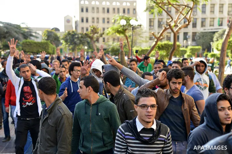 Egyptian supporters of Muslim Brotherhood who belonged to "Students against Coup" movement participate in a demonstration to demand the release of their detained colleagues, outside the Cairo University, Cairo December 2...