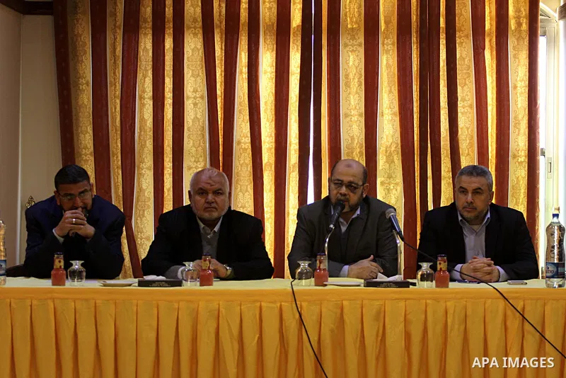 Senior Hamas leader Mousa Abu Marzouk, meets with members of civil society organizations and Palestinian factions, in Gaza city on December 28, 2014. Photo by Mohammed Asad
