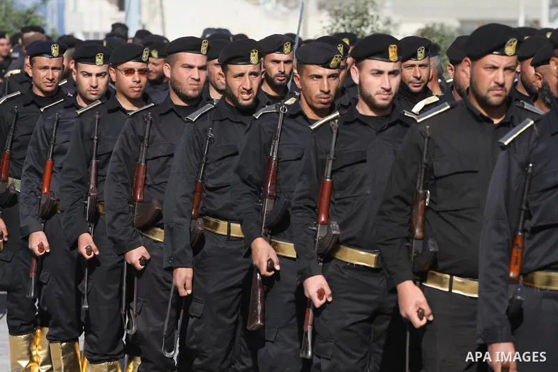 Palestinian members of national security forces march during a military rally to commemorated the sixth anniversary of the beginning of Israel's 22-day offensive on the Gaza Strip in 2008-9 that left more than 1,400 dead...