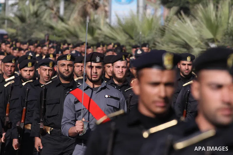 Palestinian members of national security forces march during a military rally to commemorated the sixth anniversary of the beginning of Israel's 22-day offensive on the Gaza Strip in 2008-9 that left more than 1,400 dead...
