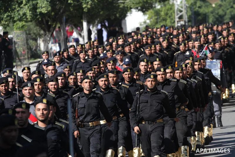 Palestinian members of national security forces march during a military rally to commemorated the sixth anniversary of the beginning of Israel's 22-day offensive on the Gaza Strip in 2008-9 that left more than 1,400 dead...