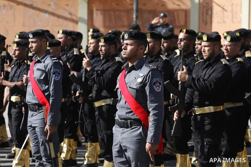 Palestinian members of national security forces march during a military rally to commemorated the sixth anniversary of the beginning of Israel's 22-day offensive on the Gaza Strip in 2008-9 that left more than 1,400 dead...