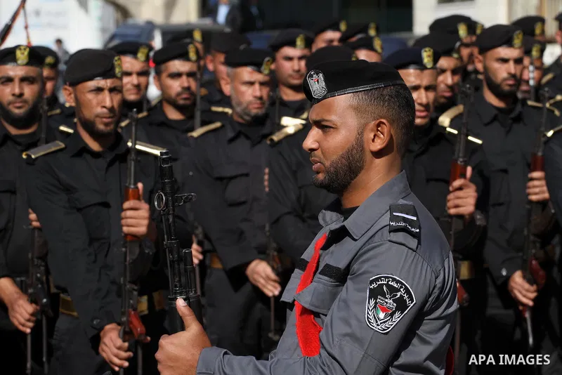 Palestinian members of national security forces march during a military rally to commemorated the sixth anniversary of the beginning of Israel's 22-day offensive on the Gaza Strip in 2008-9 that left more than 1,400 dead...