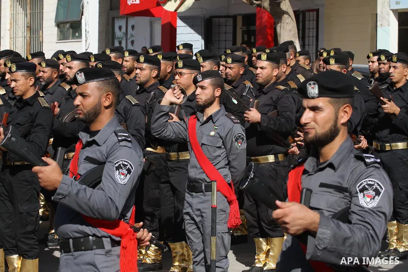 Palestinian members of national security forces march during a military rally to commemorated the sixth anniversary of the beginning of Israel's 22-day offensive on the Gaza Strip in 2008-9 that left more than 1,400 dead...