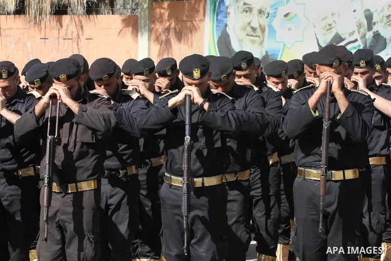 Palestinian members of national security forces march during a military rally to commemorated the sixth anniversary of the beginning of Israel's 22-day offensive on the Gaza Strip in 2008-9 that left more than 1,400 dead...