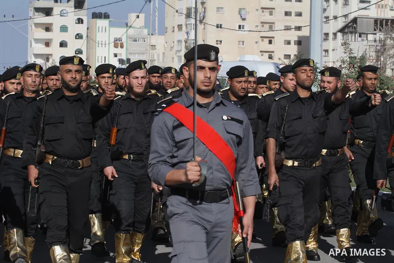Palestinian members of national security forces march during a military rally to commemorated the sixth anniversary of the beginning of Israel's 22-day offensive on the Gaza Strip in 2008-9 that left more than 1,400 dead...
