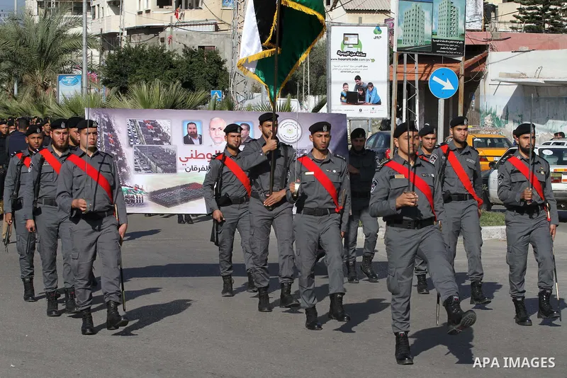 Palestinian members of national security forces march during a military rally to commemorated the sixth anniversary of the beginning of Israel's 22-day offensive on the Gaza Strip in 2008-9 that left more than 1,400 dead...