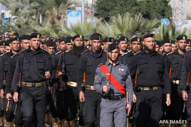 Palestinian members of national security forces march during a military rally to commemorated the sixth anniversary of the beginning of Israel's 22-day offensive on the Gaza Strip in 2008-9 that left more than 1,400 dead...
