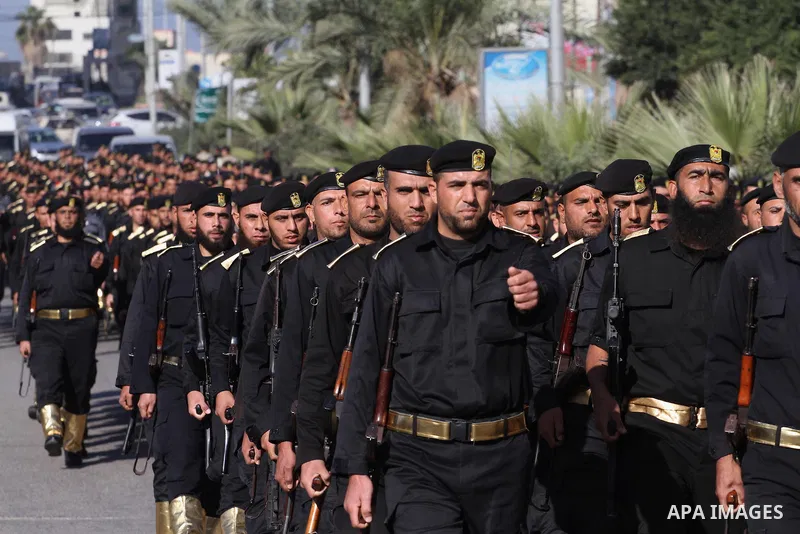 Palestinian members of national security forces march during a military rally to commemorated the sixth anniversary of the beginning of Israel's 22-day offensive on the Gaza Strip in 2008-9 that left more than 1,400 dead...