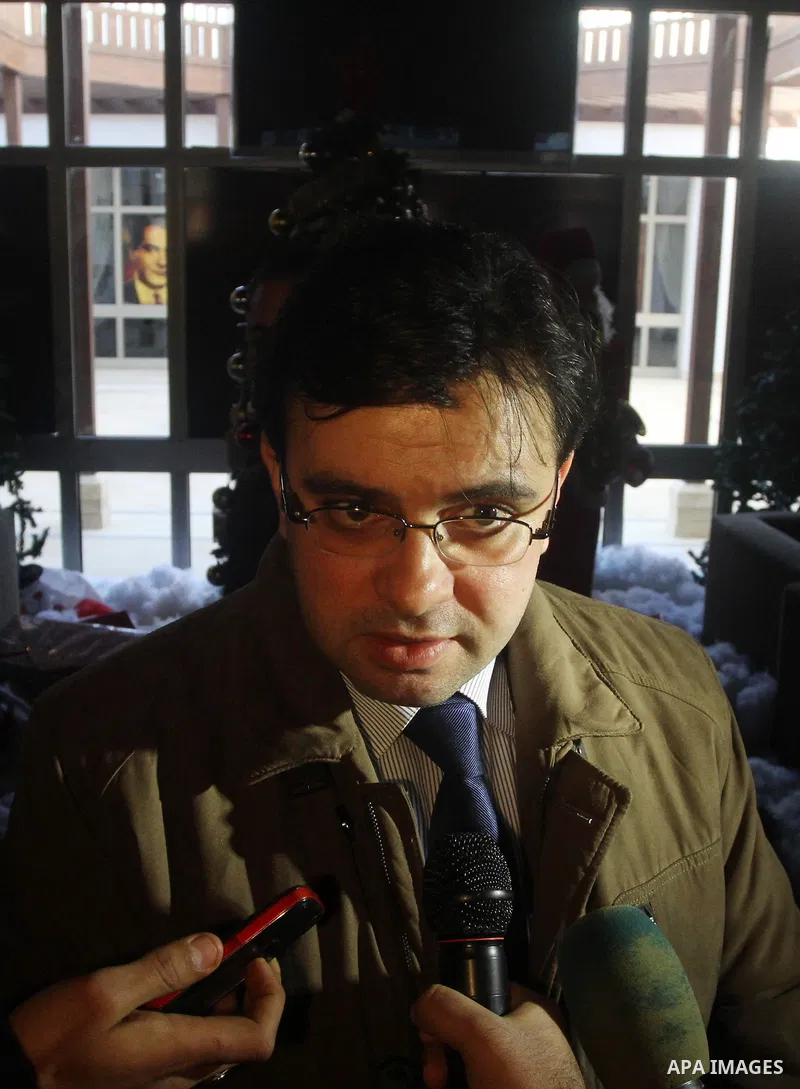 Spokesman of Palestinian unity government Ehab Bsaiso, speaks to media upon arrival to the Gaza Strip, in Gaza city on December 29, 2014. Around 50 Palestinian unity government officials, including eight ministers, arriv...