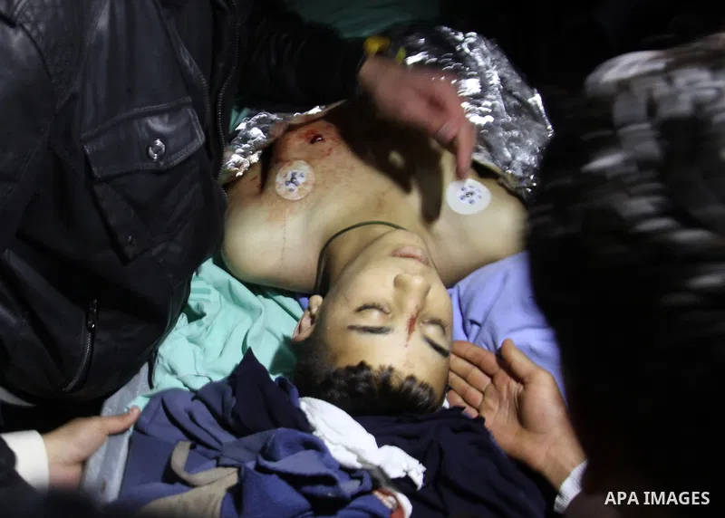 Relatives mourn over the body of Palestinian Imam Dwikat after he was shot dead by Israeli troops near the West Bank village of Beita, at a hospital morgue in Nablus December 29, 2014. Israeli soldiers shot and killed Dw...