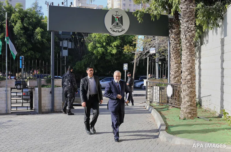 Palestinian Minister of Justice Salim Al Sakkaa arrives the headquarters of Council of ministers, in Gaza city, on December 30, 2014. Around 50 Palestinian unity government officials, including eight ministers, arrived i...