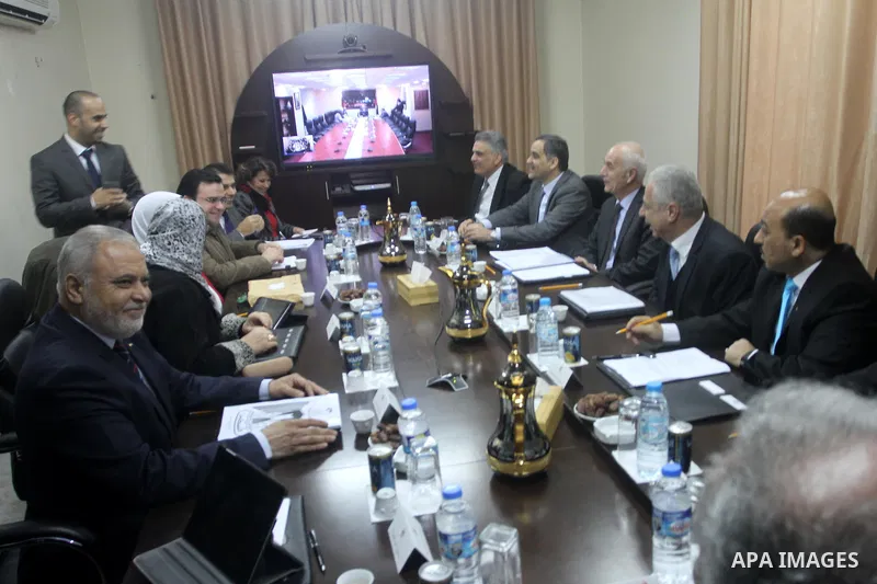 Ministers of the Palestinian unity government at Council of ministers, in Gaza strip attend a meeting in Gaza city, on December 30, 2014. Around 50 Palestinian unity government officials, including eight ministers, arriv...