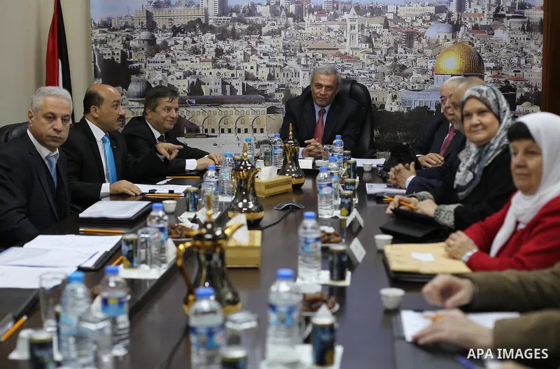 Ministers of the Palestinian unity government at Council of ministers, in Gaza strip attend a meeting in Gaza city, on December 30, 2014. Around 50 Palestinian unity government officials, including eight ministers, arriv...