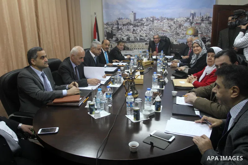 Ministers of the Palestinian unity government at Council of ministers, in Gaza strip attend a meeting in Gaza city, on December 30, 2014. Around 50 Palestinian unity government officials, including eight ministers, arriv...