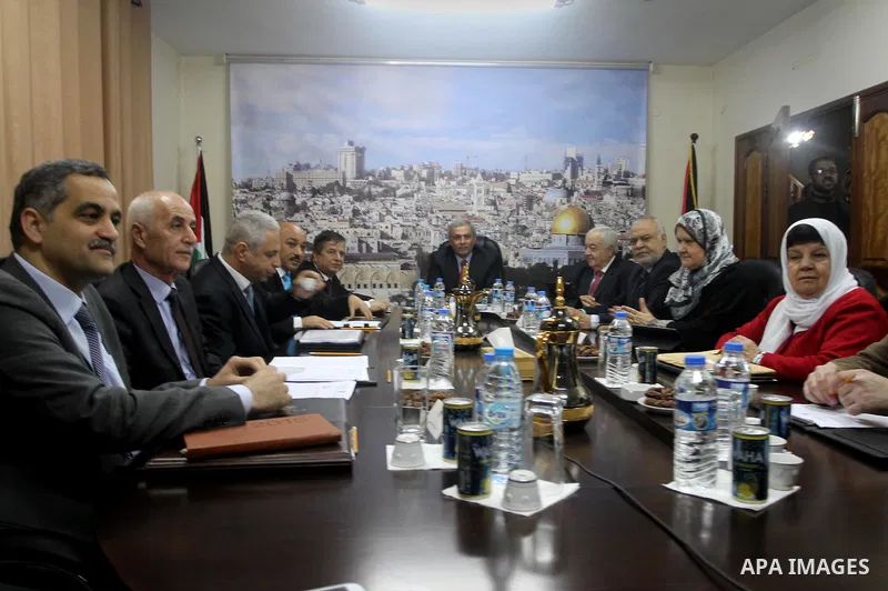 Ministers of the Palestinian unity government at Council of ministers, in Gaza strip attend a meeting in Gaza city, on December 30, 2014. Around 50 Palestinian unity government officials, including eight ministers, arriv...