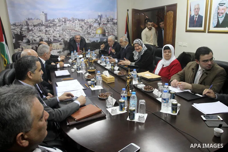 Ministers of the Palestinian unity government at Council of ministers, in Gaza strip attend a meeting in Gaza city, on December 30, 2014. Around 50 Palestinian unity government officials, including eight ministers, arriv...