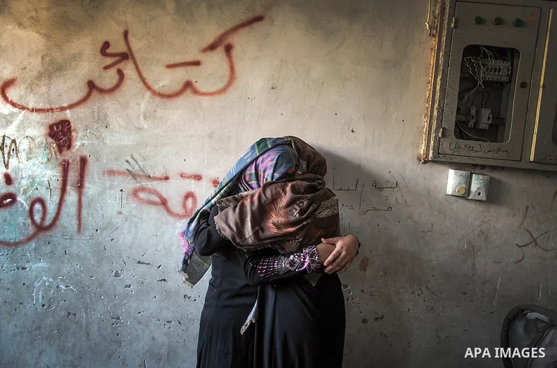 A relative of Palestinians from the al-Ghol family, whom medics said were killed in an Israeli air strike on a house, mourns during their funeral in Rafah in the southern Gaza Strip August 3, 2014. Renewed Israeli shelli...