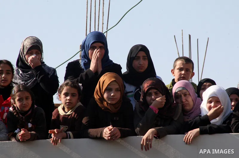 Relatives of 17-year-old Palestinian teenager Omam Dwekat, who was shot dead by Israeli troops the day before, mourn for him during the funeral in the West Bank village of Baita, near of Nablus, on Dec. 30, 2014. Dwekat...
