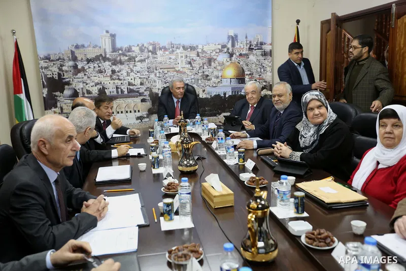Ministers of the Palestinian unity government at Council of ministers, in Gaza strip attend a meeting in Gaza city, on December 30, 2014. Around 50 Palestinian unity government officials, including eight ministers, arriv...