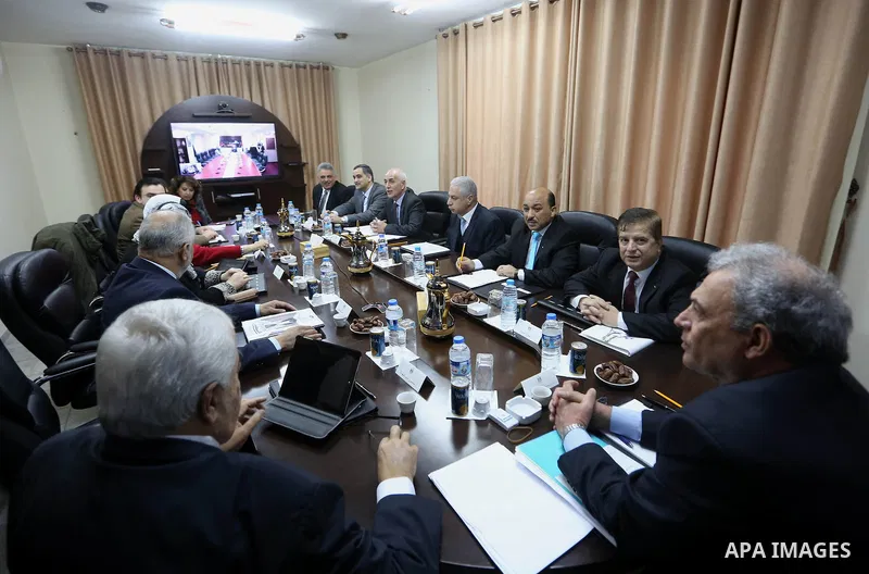 Ministers of the Palestinian unity government at Council of ministers, in Gaza strip attend a meeting in Gaza city, on December 30, 2014. Around 50 Palestinian unity government officials, including eight ministers, arriv...